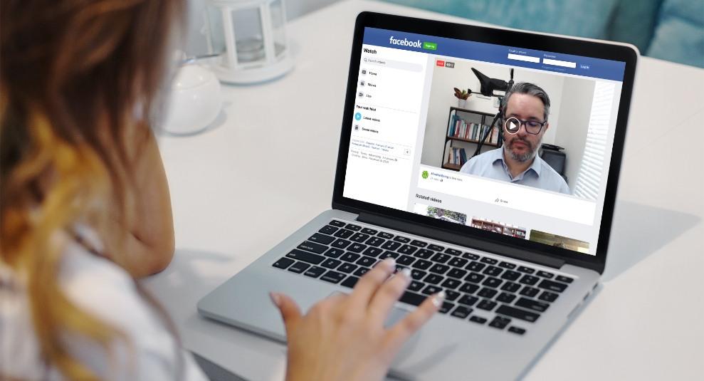 Woman watching video on laptop