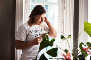 Articles 1 woman eyes closed thinking flower with coffee break relax memories home female person apartment smile happy with cup tea drink plant rest chill self care